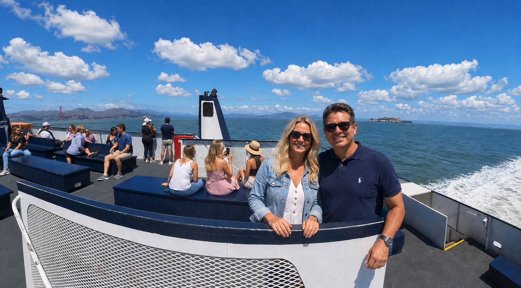 A couple poses during their San Francisco sightseeing cruise