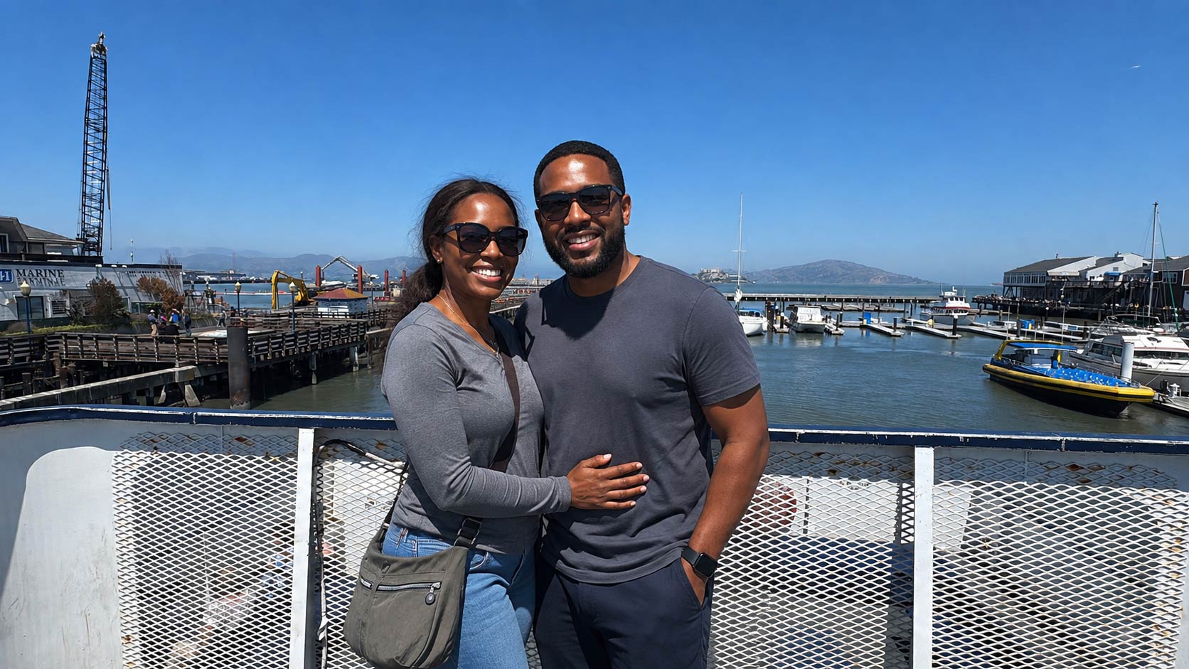 A couple poses before their cruise starts in San Francisco